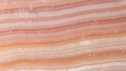 Close-up of banded onyx showcasing its layered, translucent, peach and white hues.