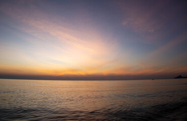 Beautiful sunset on the sea beach with coconut tree for travel in holiday