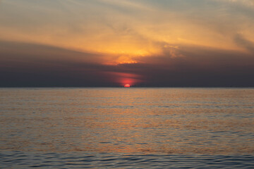 Beautiful sunset on the sea beach with coconut tree for travel in holiday