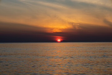 Beautiful sunset on the sea beach with coconut tree for travel in holiday