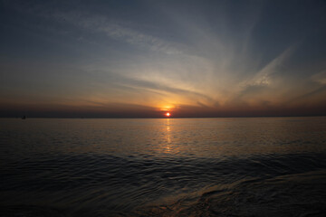 Beautiful sunset on the sea beach with coconut tree for travel in holiday