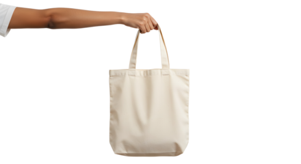Arm holding a reusable offwhite cotton tote bag with fabric handles.