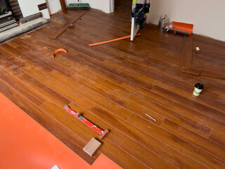 Installing Wooden Laminate Flooring with Tools and Underlay Preparation