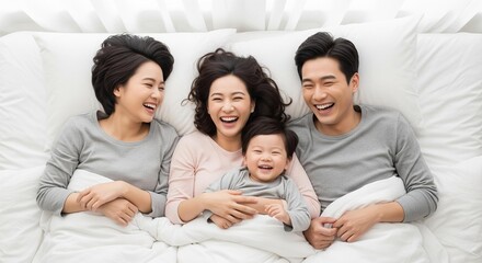 Obraz premium Family Connection: A Top-Down Portrait of Laughter and Love on a Bed