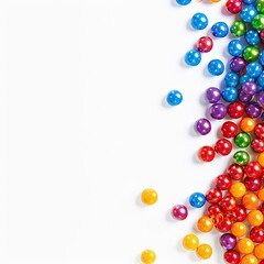 Obraz premium Colorful, round candies scattered in a rainbow pattern against a white background