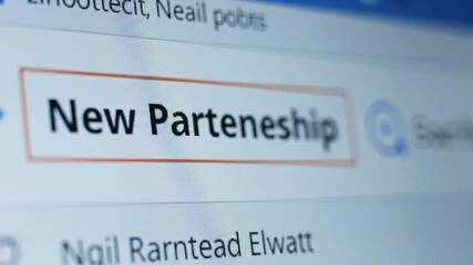 Digital communication showing a new partnership announcement highlighted on a computer screen, signifying business collaboration.