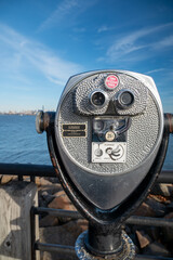 Coin-Operated Tourist Telescope Binoculars Overlooking Blue Water View