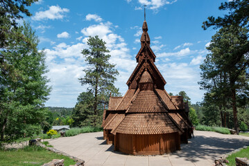 Traditional Wooden Church with Steeple and Shingled Roof