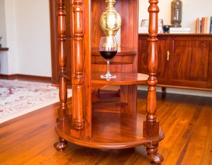 Elegant wooden stand with wine and ornamental details capturing refined taste