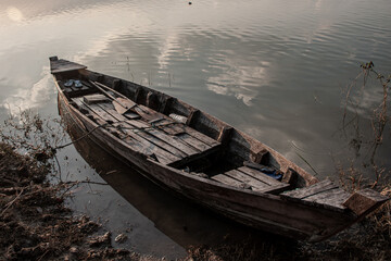 old wooden boat on the lake