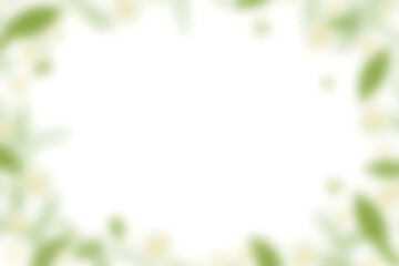 A soft focus frame of delicate white blossoms and green leaves creates a bright airy border around a blank white space perfect for text