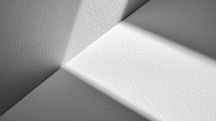 Striking, abstract showcases textured white surfaces with strong interplay light shadow. Minimalist composition highlights geometric lines forms, creating visually appealing modern aesthetic.