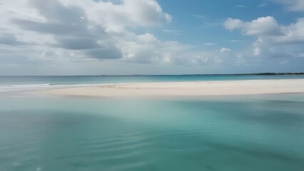Obraz premium Tropical beach with turquoise water and white sand under blue sky, embodying serene vacation bliss 