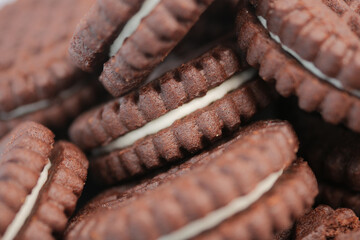 Chocolaty sandwich cookies stacked high in a tasty display