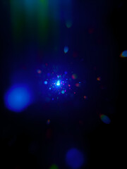 Pinpricks of light in the dark expanse appear distorted and expanded, each surrounded by a halo of blurry, chromatic aberration