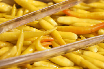 Yellow chili peppers displayed at a local market