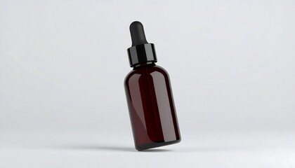 Dark brown glass dropper bottle on a light gray background.