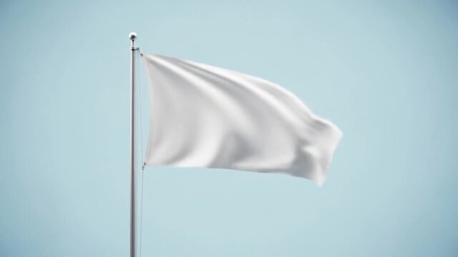 A plain white flag flutters gently against a clear, pale blue sky, symbolizing surrender or peace.