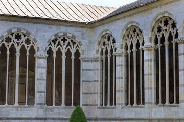 The central courtyard arched walls of the Camposanto Monumentale (Monumental Cemetery) in Pisa,...