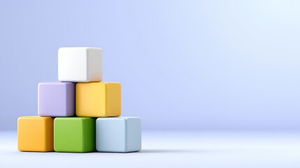 Obraz premium Colorful toy blocks stacked playfully in a serene setting.