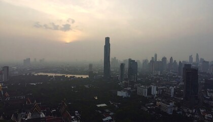 Fototapeta premium Cityscape at sunset, hazy atmosphere