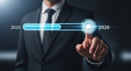 Businessman in suit touching futuristic digital progress bar from 2025 to 2026, symbolizing innovation, technology advancement, and future planning in modern corporate environment