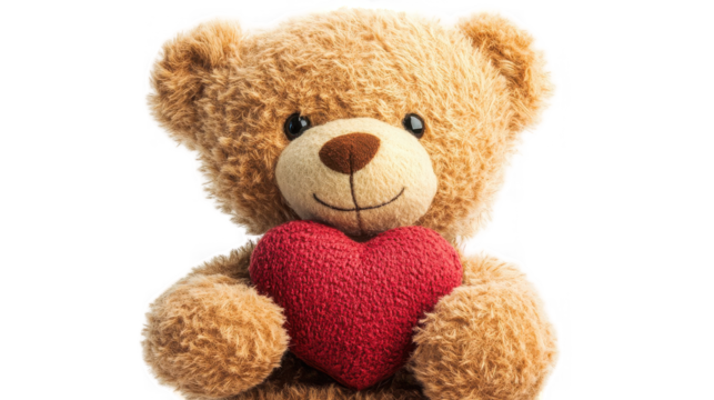 Plush teddy bear holding a red heart, symbol of love and affection on transparent background