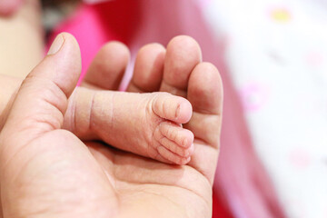 Pictures of foot of baby boy with concept photos of infant children moments.