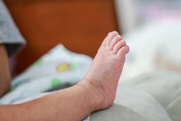 Foots of infant during sleep looking cute and cuddly.