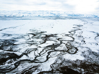 Majestic Qinghai Lake Shore With Winding Snowcapped Mountains Under Dramatic Sky