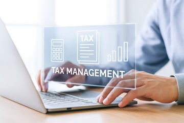 Person working on a laptop with a tax management interface.