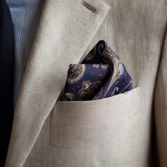 A man is wearing a suit and tie