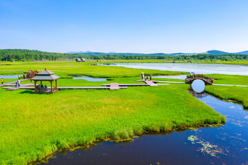 Beautiful Scenic View Of Qixing Lake Amid Rolling Grasslands