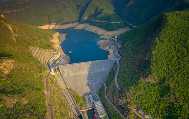 Hydropower Dam And Reservoir Nestled In Mountainous Canyon Landscape Photo