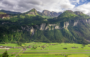 Majestic Swiss Snowcapped Mountains Towering Over Alpine Landscape Photo
