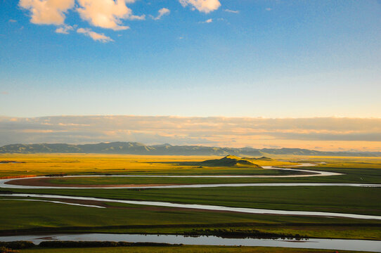 Scenic Meandering Yellow River With Nine Bends And Eighteen Winding Curves Carving Dramatic Serene Majestic Aquatic Pathway In A Colorful Vast Remote Landscape