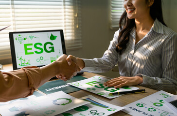 Businesswomen shaking hands on environmental, social, and governance project