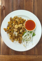 A local food of Phuket Province, Thailand, called O Tao, consists of small oysters coated in flour, fried and seasoned with a unique flavor.