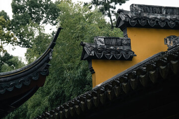 Traditional chinese temple architecture with distinctive rooftop decorations in natural light