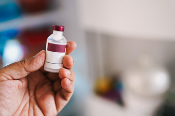 Doctor holding insulin vial for diabetes treatment
