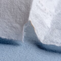 A white tissue paper with a tear in it
