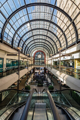 Stylish Shopping Mall with Glass Roof and Curved Walkway