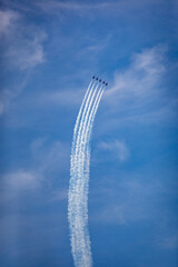Aerospace Extravaganza: Blue Jet Contrails against Azure Sky