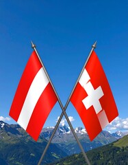 Two crossed flags, Austrian and Swiss, against a mountainous backdrop