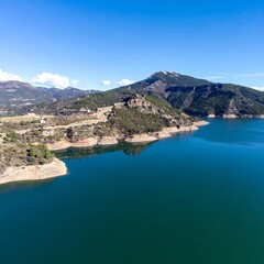 Mountain lake, blue water, green hills