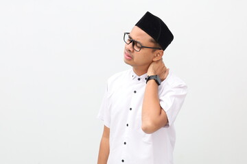 Asian muslim man suffering from neck pain. Isolated on white with copyspace