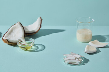 Coconut halves styled with a glass of coconut rice. This scene represents nutrition, hydration, and...