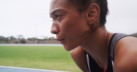 Breathing, athlete and woman with sweat, outdoor or tired of exercise in morning, training or...