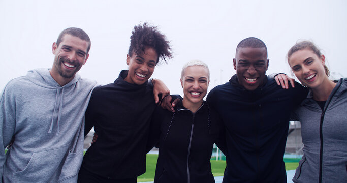 Fitness, hug and portrait of athlete people in stadium for bonding, competition or support. Exercise, smile and teamwork with group of happy friends outdoor at venue for health, training or workout - Powered by Adobe