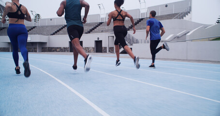 Running, competition and fitness with people on race track for workout, challenge and marathon....